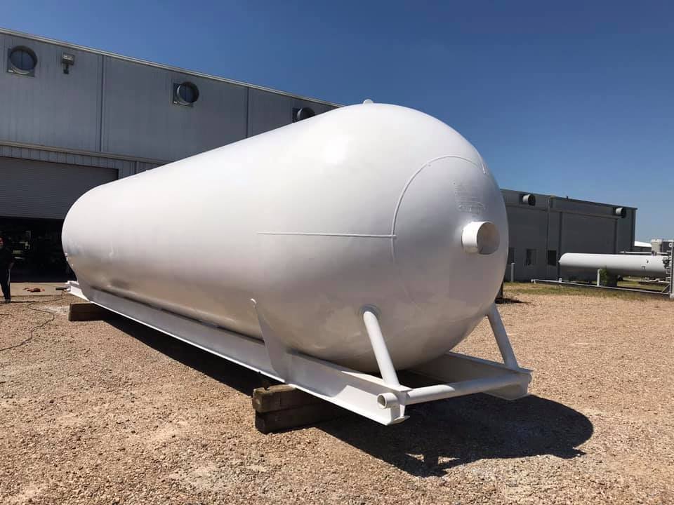 Large white propane storage tank from Grand Stock Supply